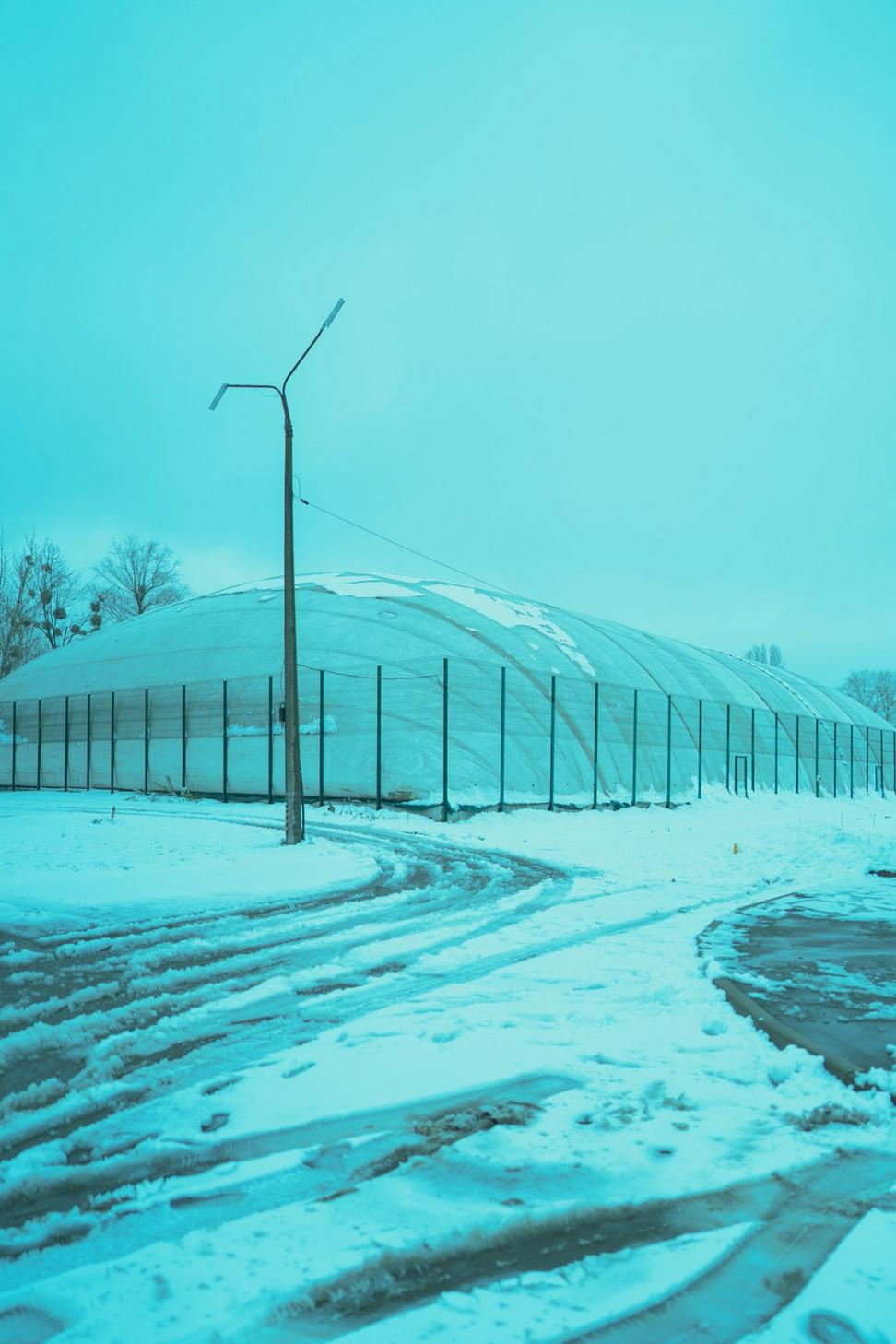 Winter greenhouse covered in snow